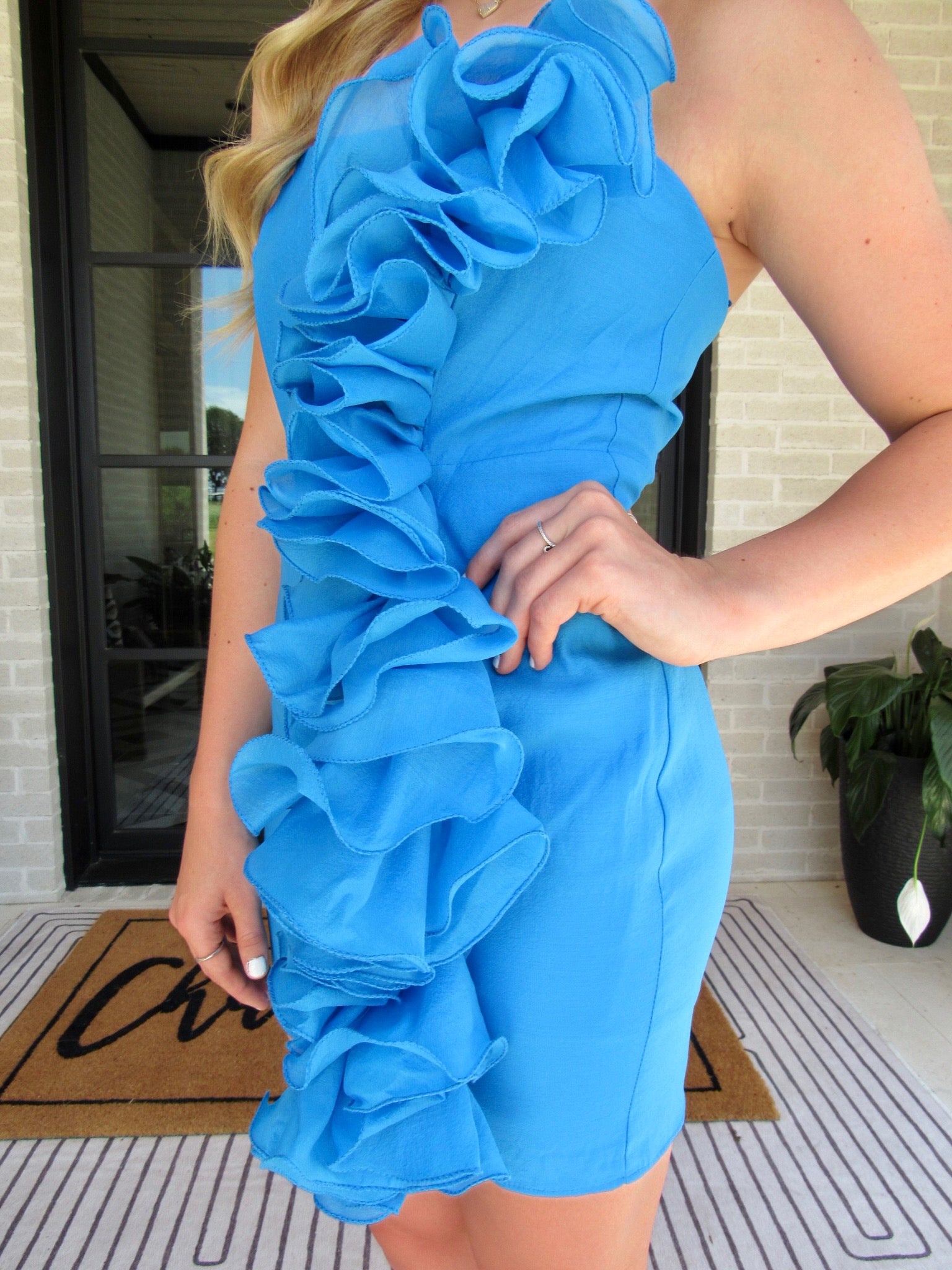 model wearing blue dress close up